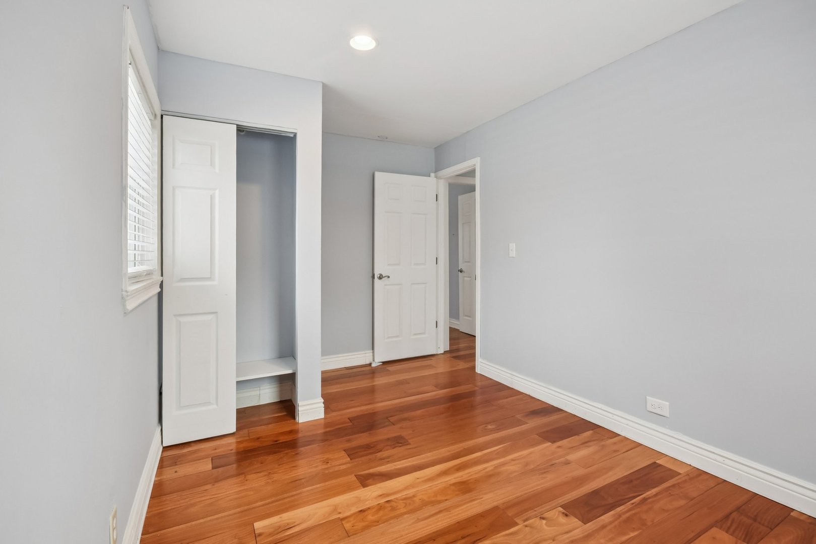 301 Villa Road Streamwood, IL 60107 - Photo 13 of 34 a view of an empty room with wooden floor
