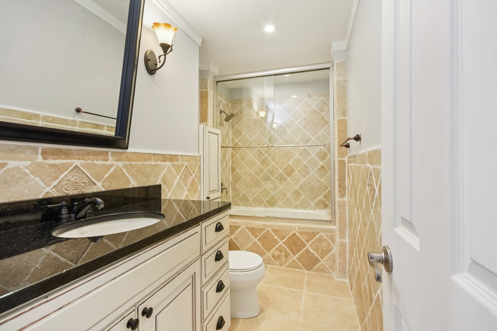 301 Villa Road Streamwood, IL 60107 - Photo 18 of 34 a bathroom with a shower and a sink