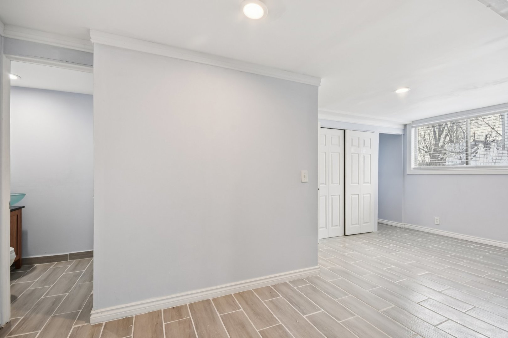 301 Villa Road Streamwood, IL 60107 - Photo 23 of 34 a view of an empty room with wooden floor and a window