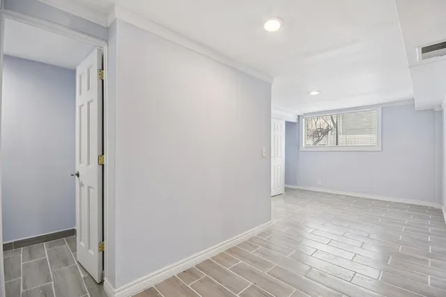 a view of an empty room and window