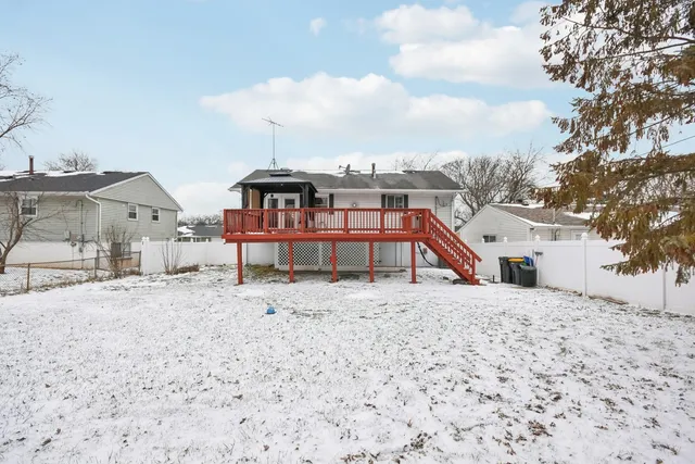 a view of a house with a snow in the background