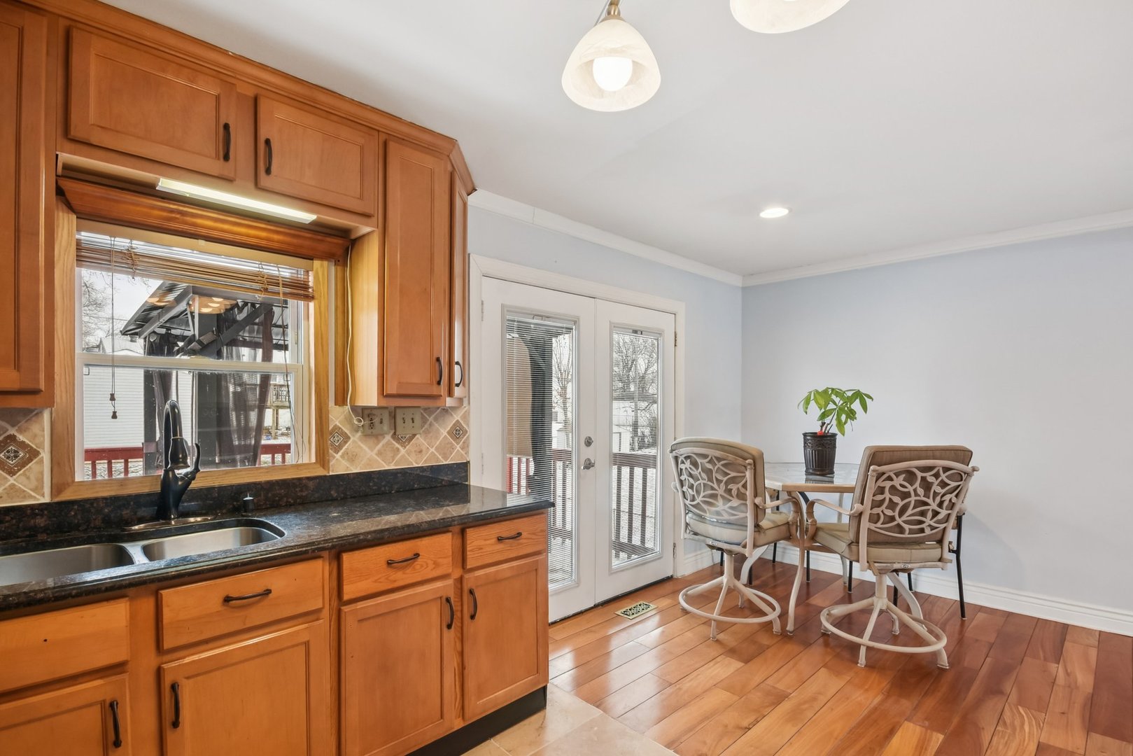 301 Villa Road Streamwood, IL 60107 - Photo 10 of 34 a view of a dining room with furniture window and wooden floor