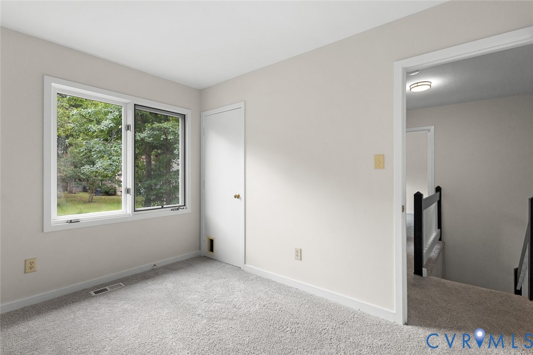 12916 Copperas Lane Henrico, VA 23233 - Photo 17 of 26 an empty room with windows