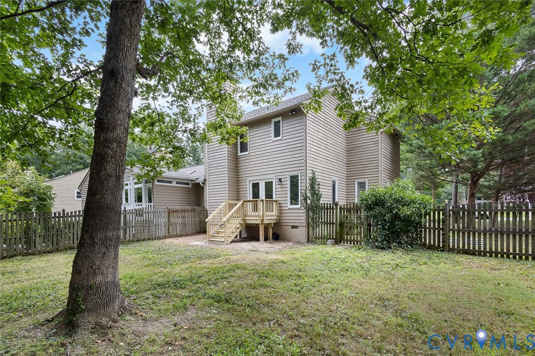 12916 Copperas Lane Henrico, VA 23233 - Photo 22 of 26 a view of a house with backyard and a tree