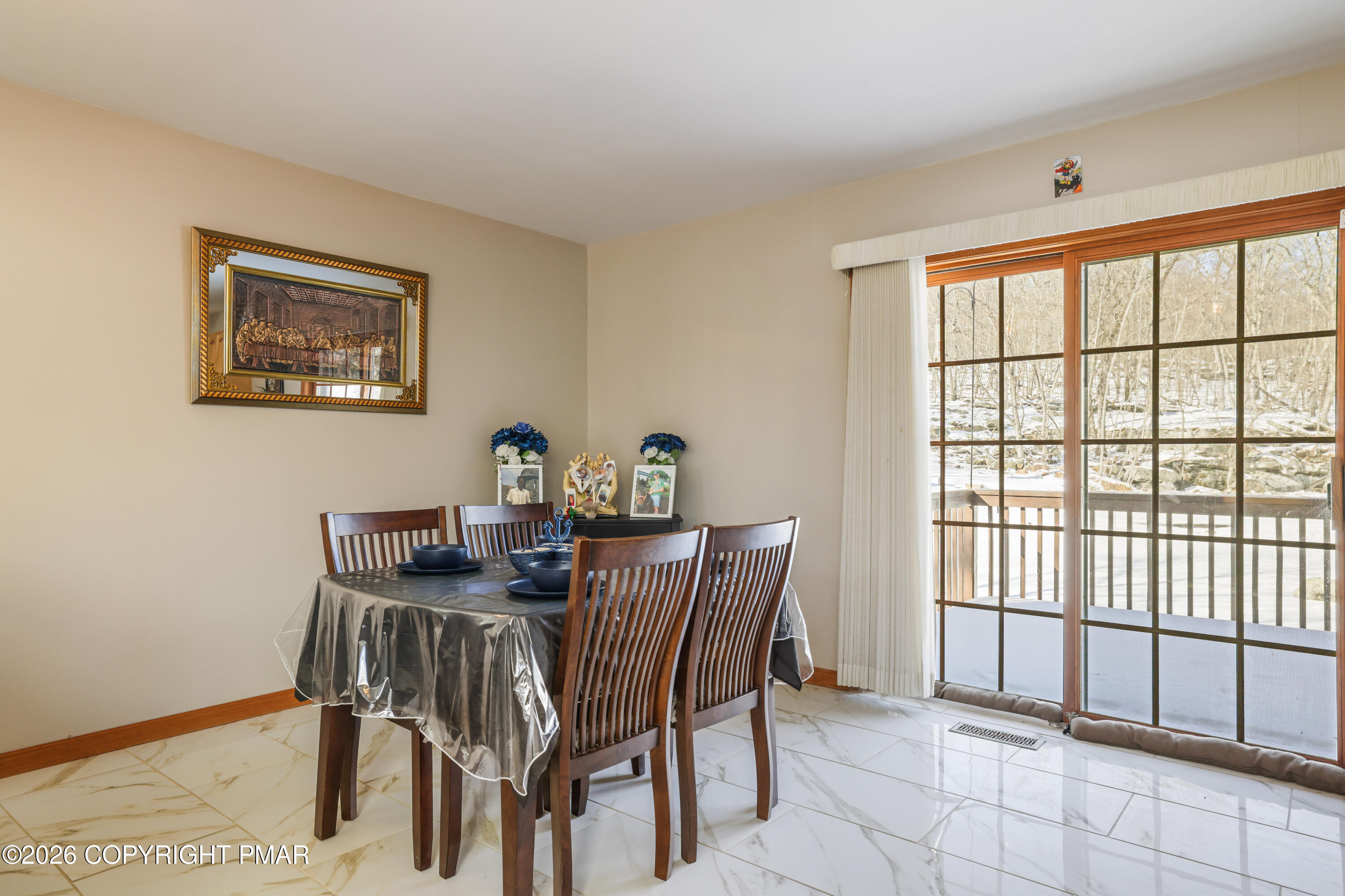 3220 Cherry Ridge Road Bushkill, PA 18324 - Photo 11 of 47 a view of a dining room with furniture and a window
