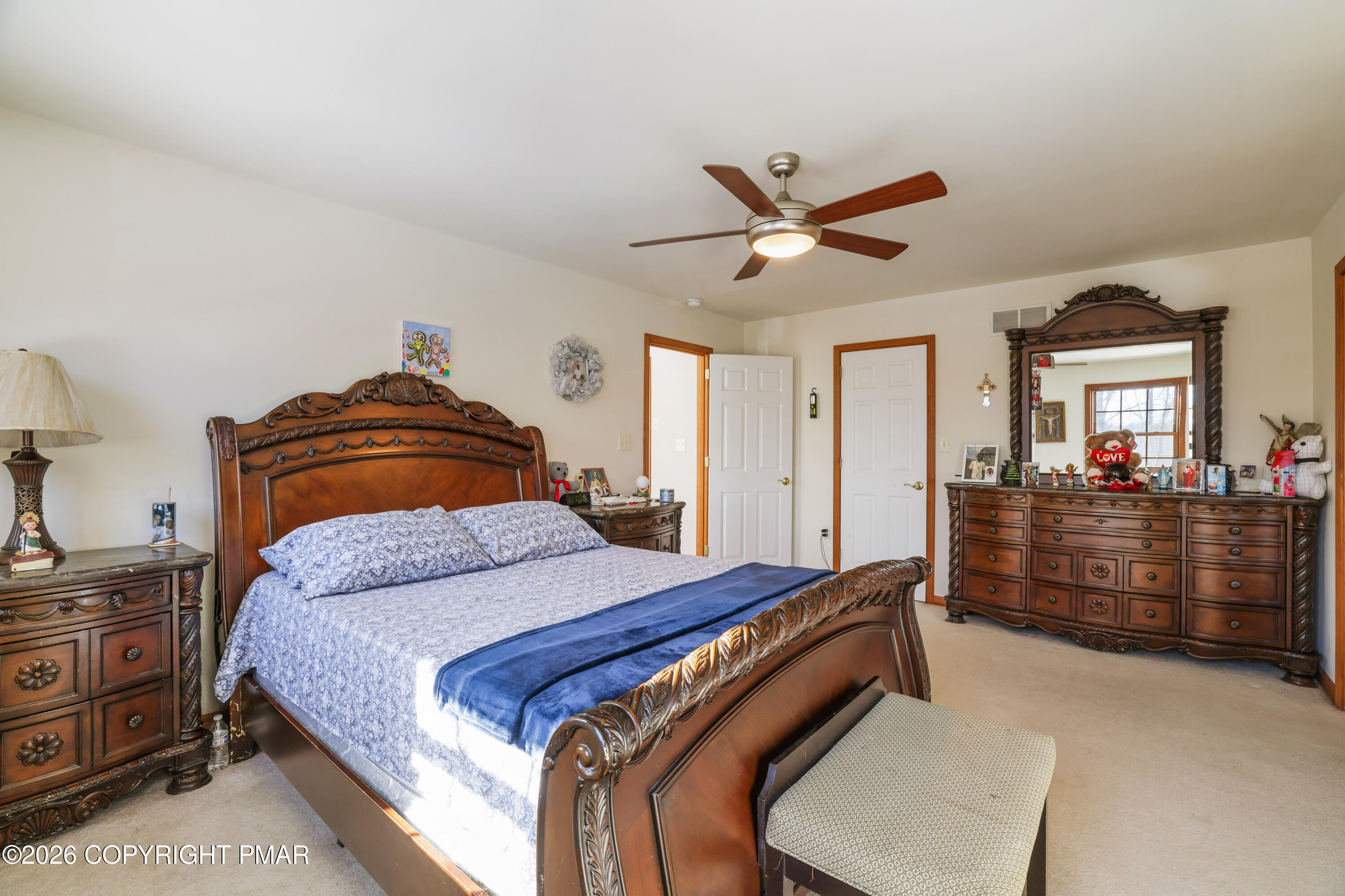 3220 Cherry Ridge Road Bushkill, PA 18324 - Photo 12 of 47 a bedroom with a bed and wooden floor