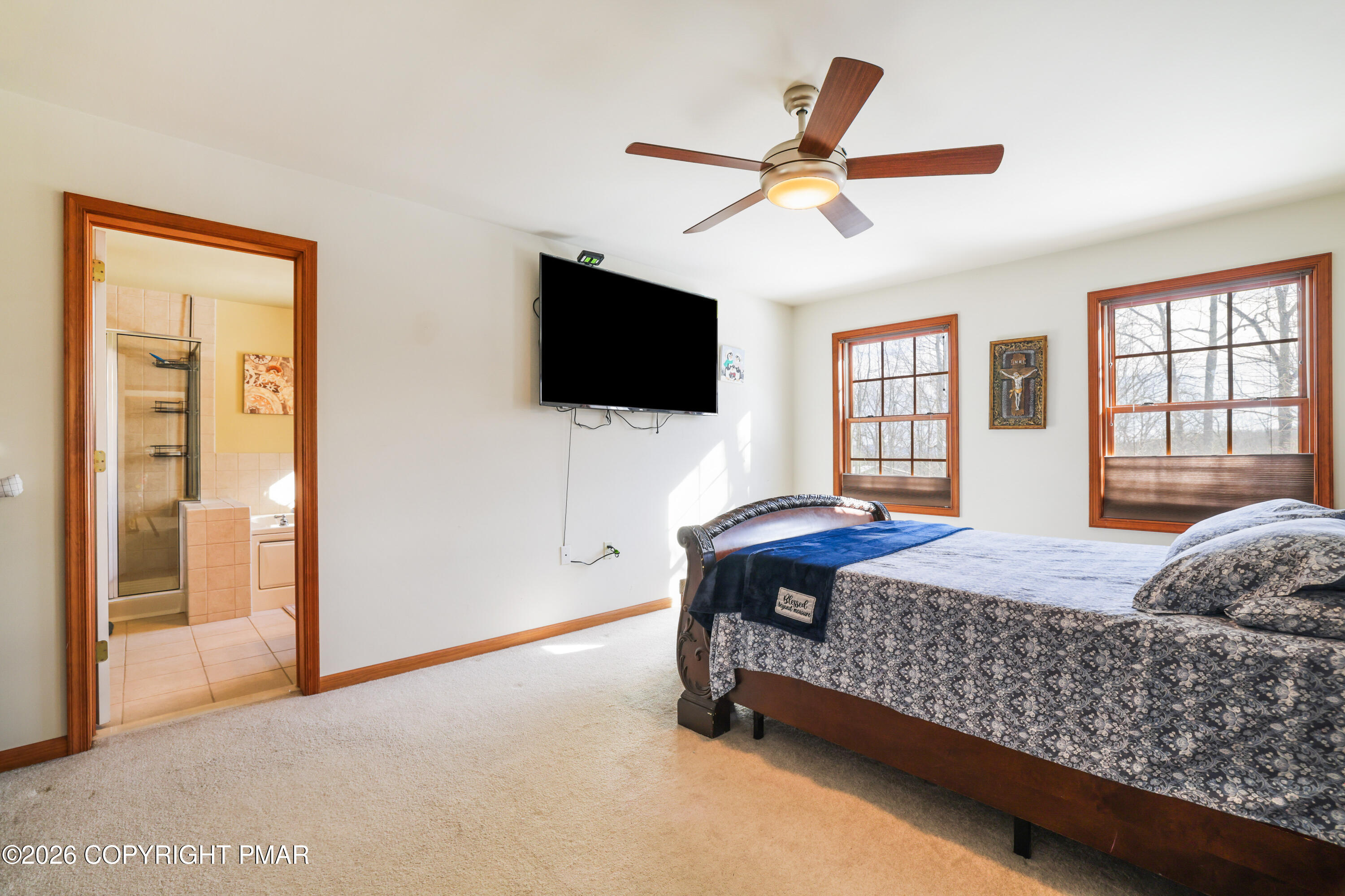 3220 Cherry Ridge Road Bushkill, PA 18324 - Photo 15 of 47 a bedroom with a bed a flat screen tv and dresser