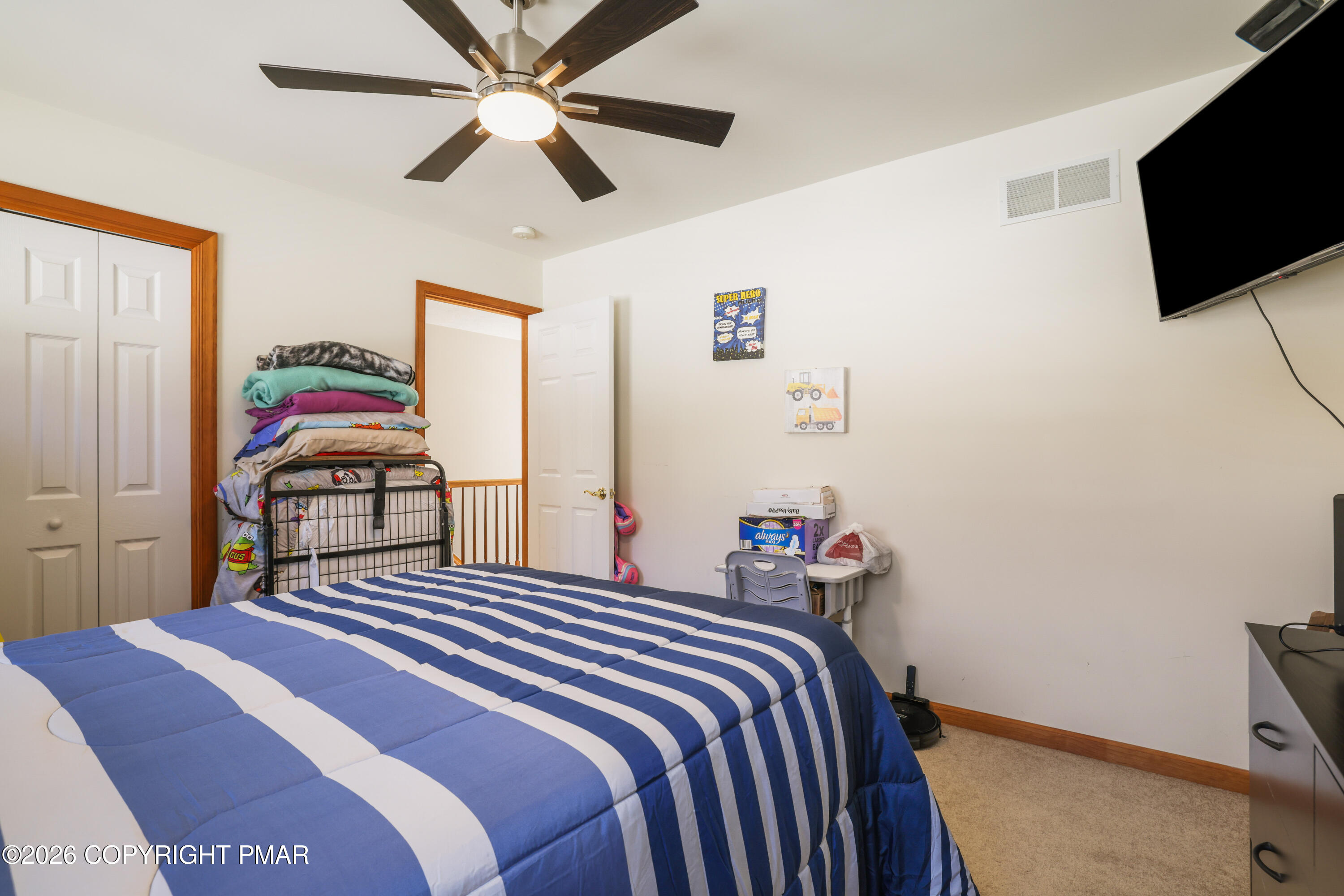 3220 Cherry Ridge Road Bushkill, PA 18324 - Photo 24 of 47 a bedroom with a bed and a flat screen tv