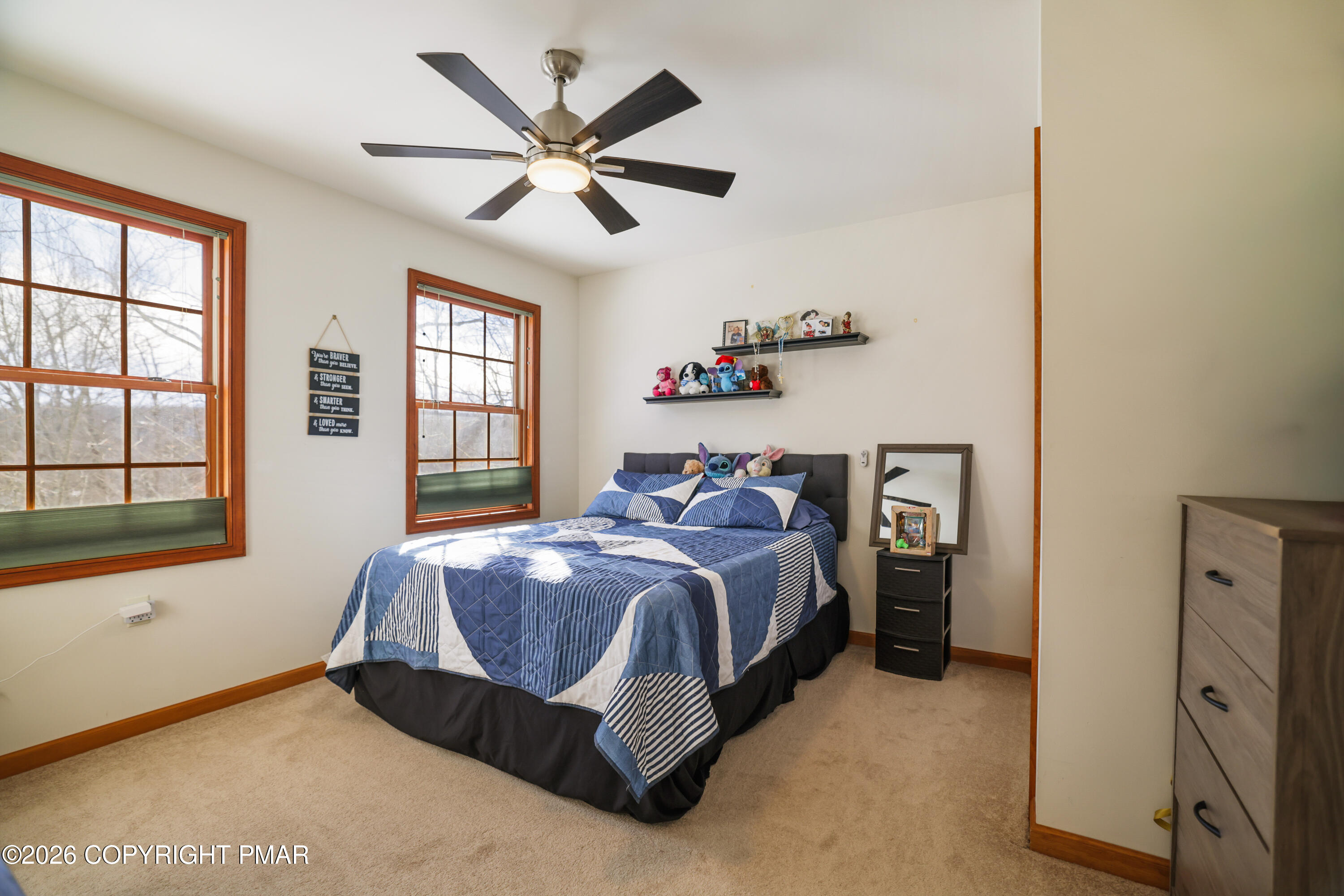 3220 Cherry Ridge Road Bushkill, PA 18324 - Photo 25 of 47 a spacious bedroom with a bed and a window