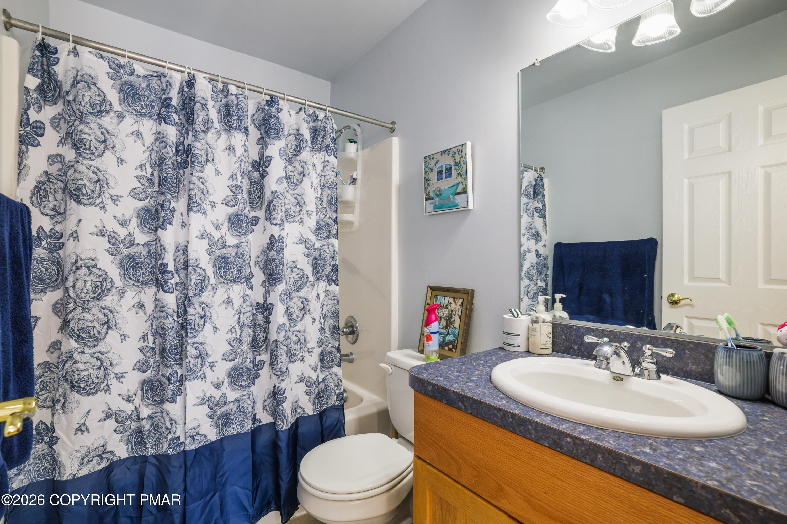 3220 Cherry Ridge Road Bushkill, PA 18324 - Photo 27 of 47 a bathroom with a granite countertop toilet sink and mirror