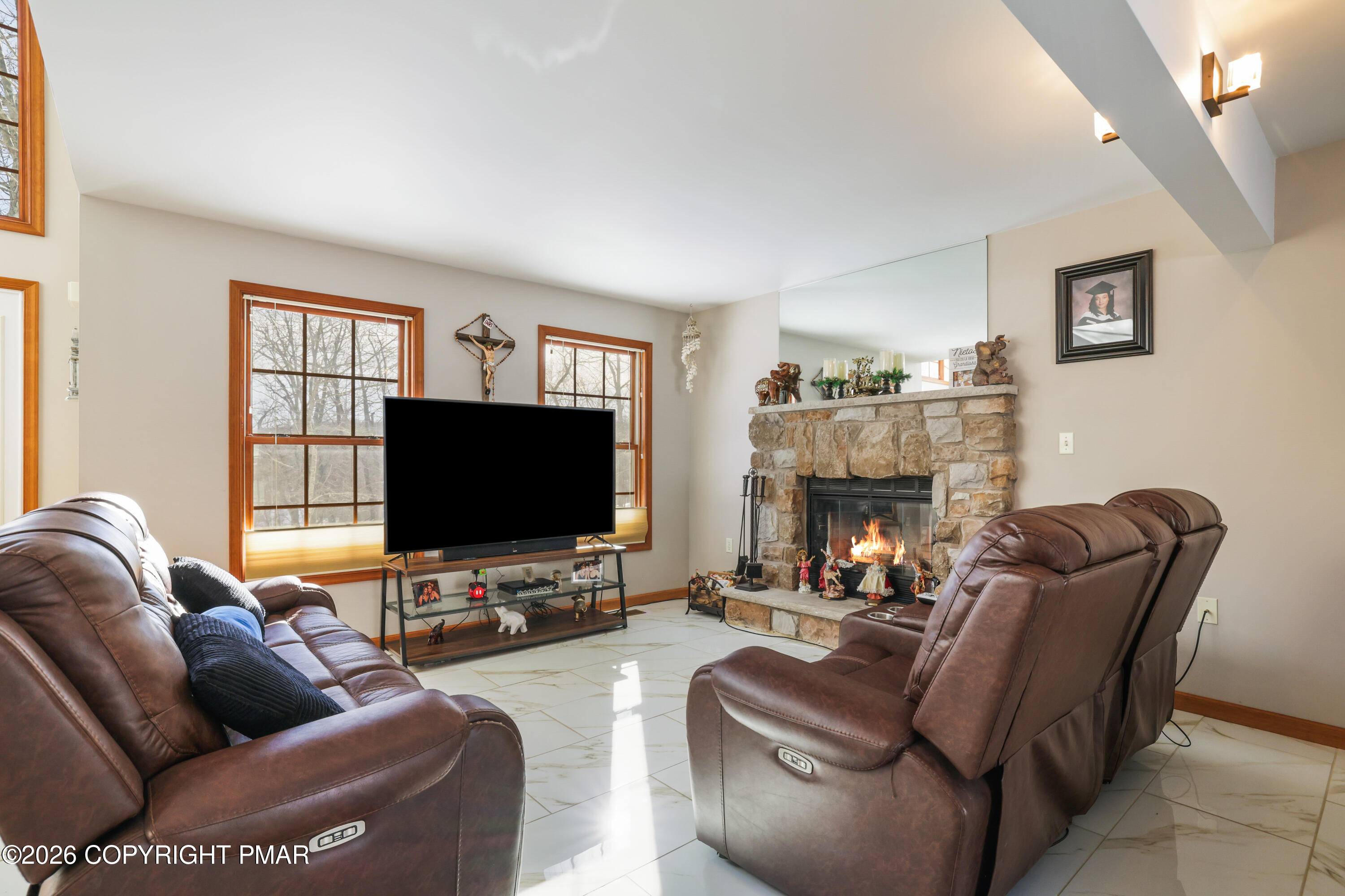 3220 Cherry Ridge Road Bushkill, PA 18324 - Photo 29 of 47 a living room with furniture and a flat screen tv