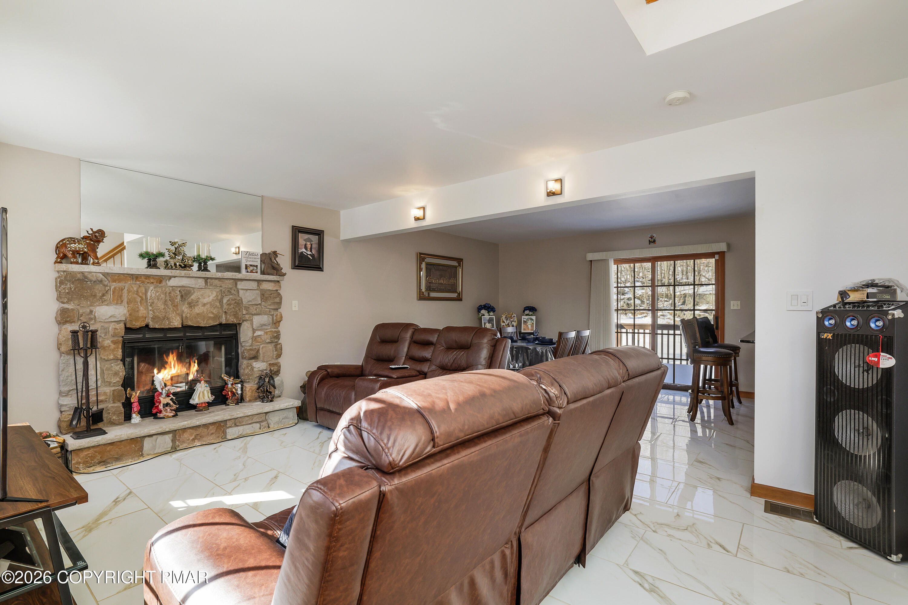 3220 Cherry Ridge Road Bushkill, PA 18324 - Photo 31 of 47 a living room with furniture and a fireplace