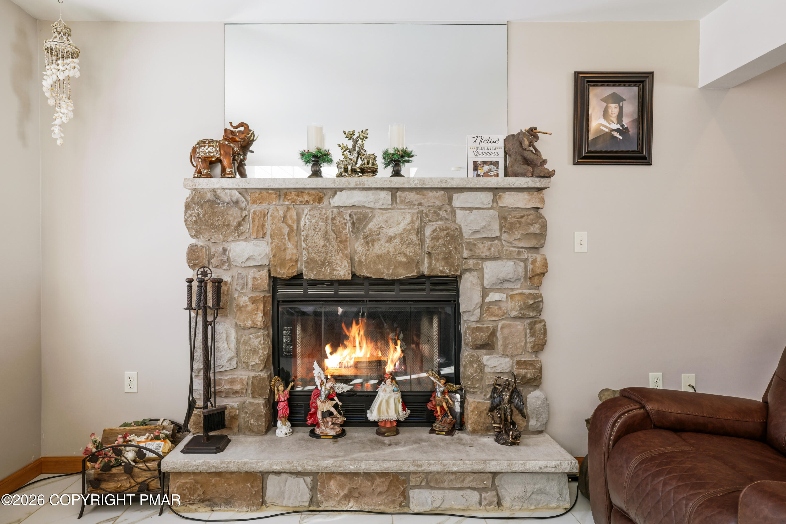 3220 Cherry Ridge Road Bushkill, PA 18324 - Photo 32 of 47 a living room with furniture and a fireplace