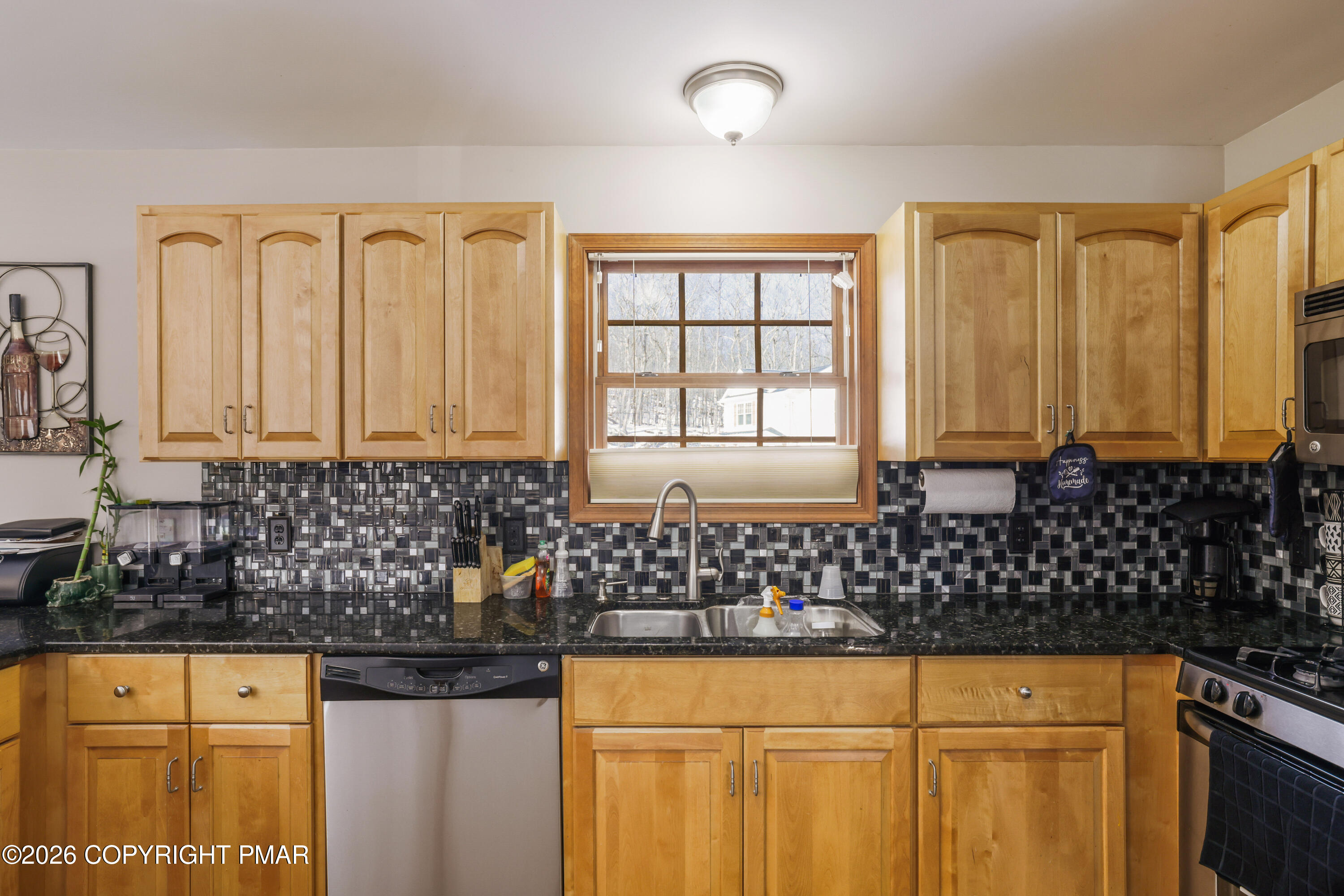 3220 Cherry Ridge Road Bushkill, PA 18324 - Photo 5 of 47 a bathroom with a granite countertop sink and a bathtub