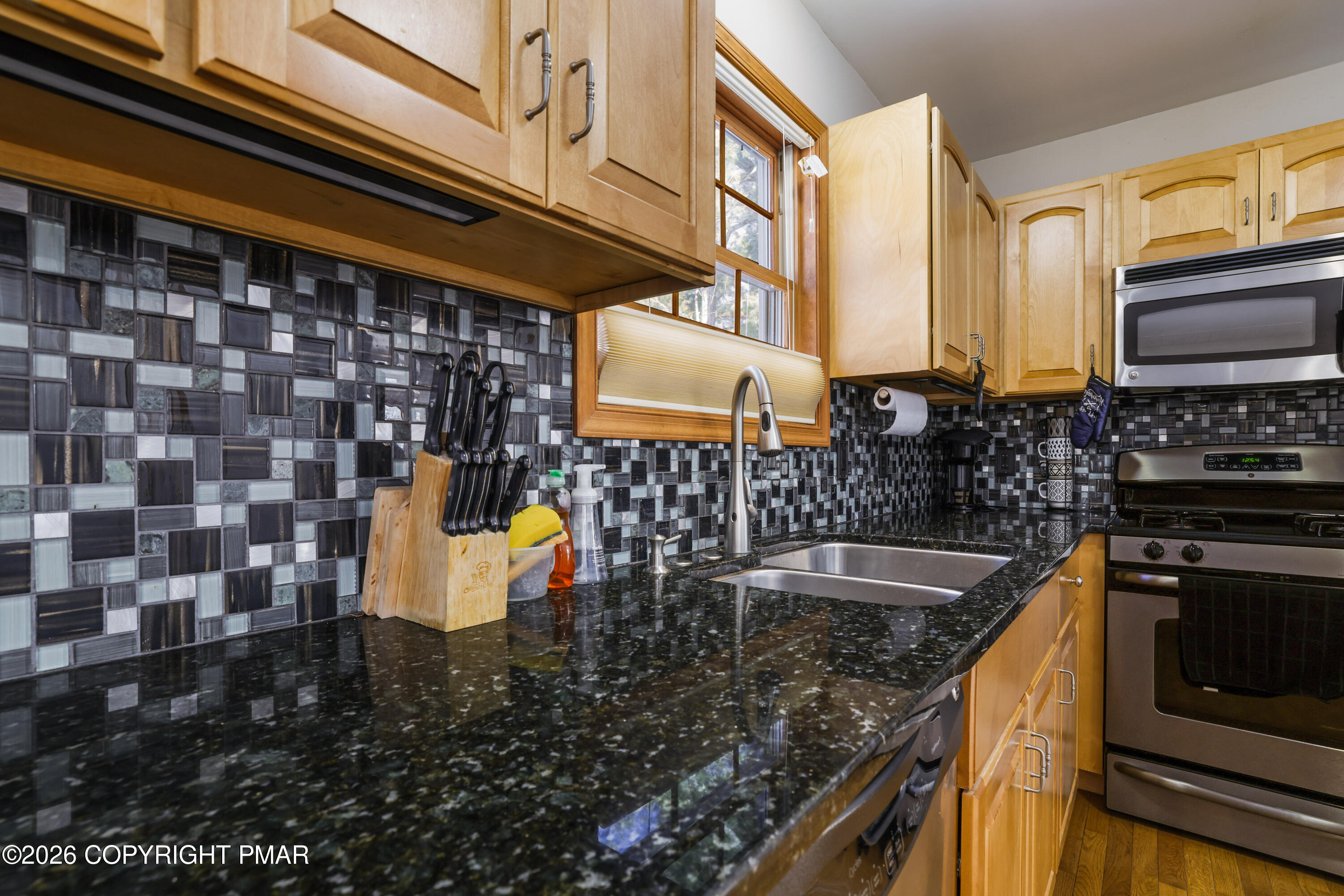 3220 Cherry Ridge Road Bushkill, PA 18324 - Photo 6 of 47 a kitchen with a sink and a stove top oven