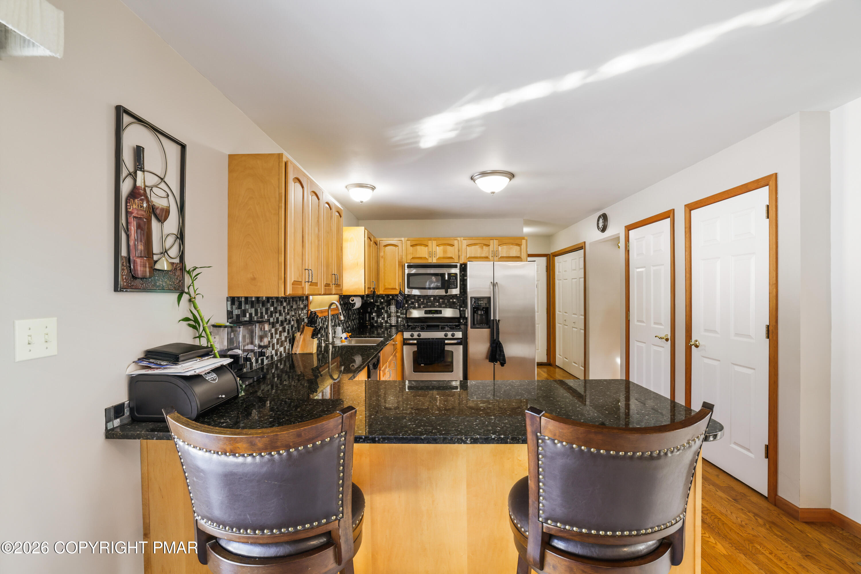 3220 Cherry Ridge Road Bushkill, PA 18324 - Photo 8 of 47 a kitchen with a table and chairs
