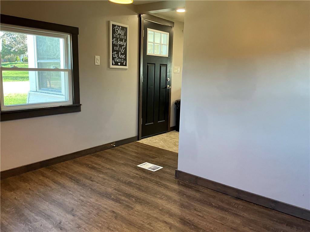 1511 Ridge Road Jeannette, PA 15644 - Photo 17 of 29 a view of an empty room with window and wooden floor