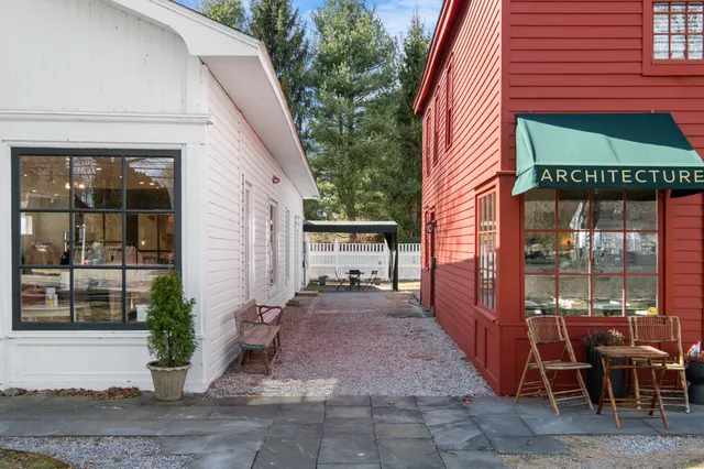 a view of a patio with table and chairs and potted plants