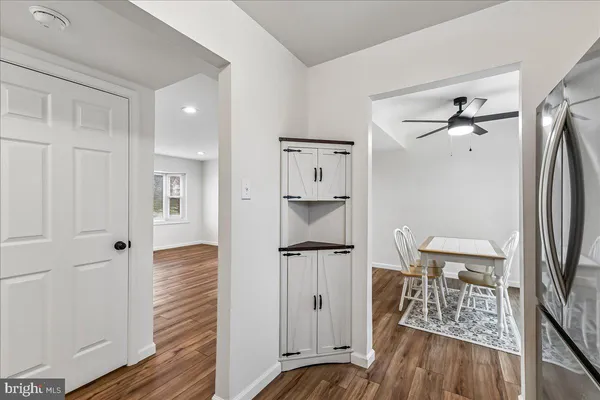a view of a walk in closet and wooden floor