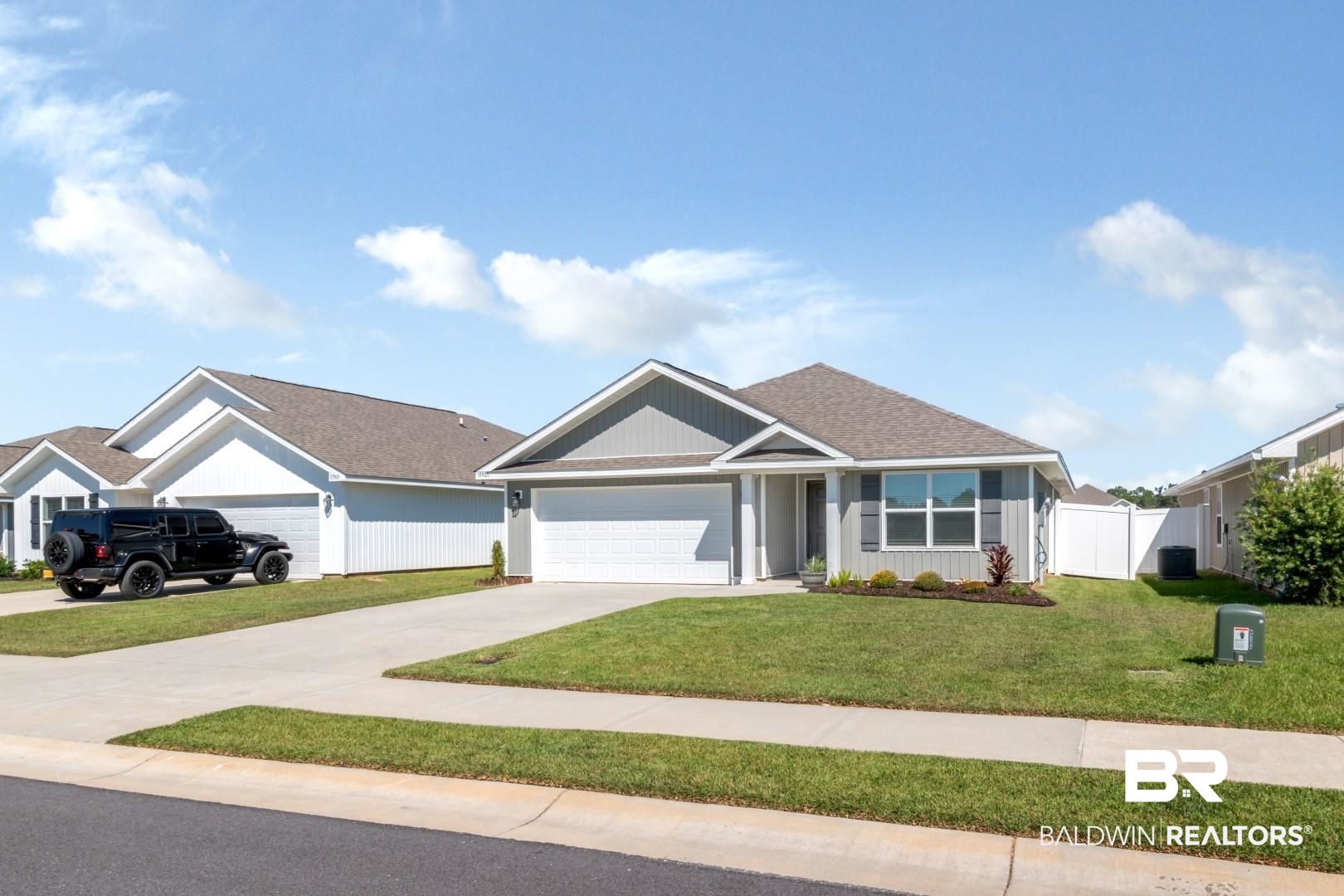 10921 Northern Dancer Court Daphne, AL 36526 - Photo 2 of 32 View of front facade featuring a front yard and a garage