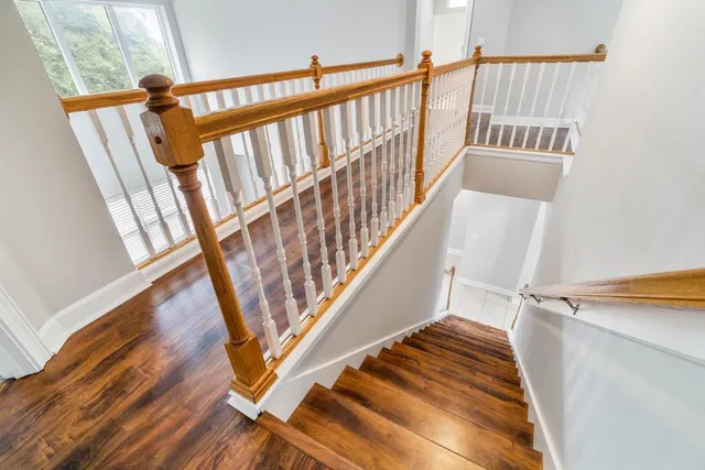 a view of entryway with wooden floor and door