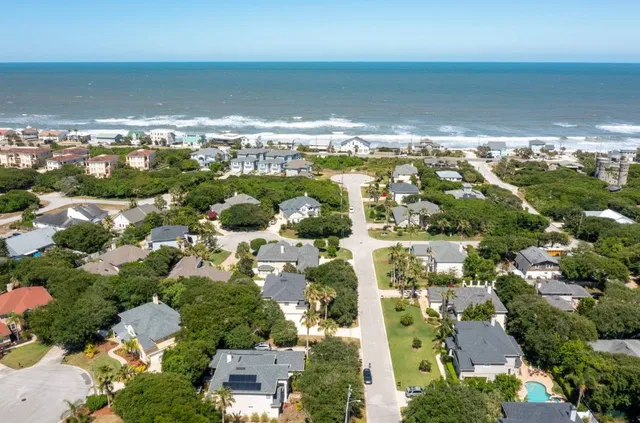 an aerial view of residential houses with outdoor space