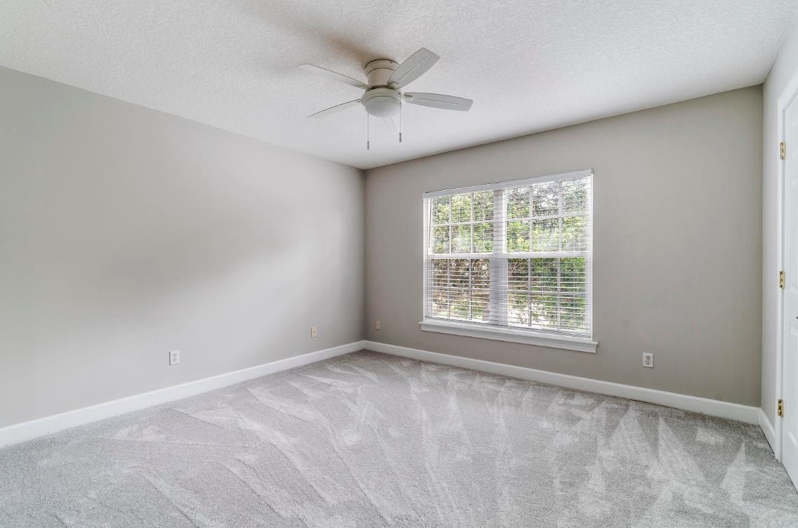 206 2nd Street St. Augustine, FL 32084 - Photo 21 of 32 an empty room with a window and a fan