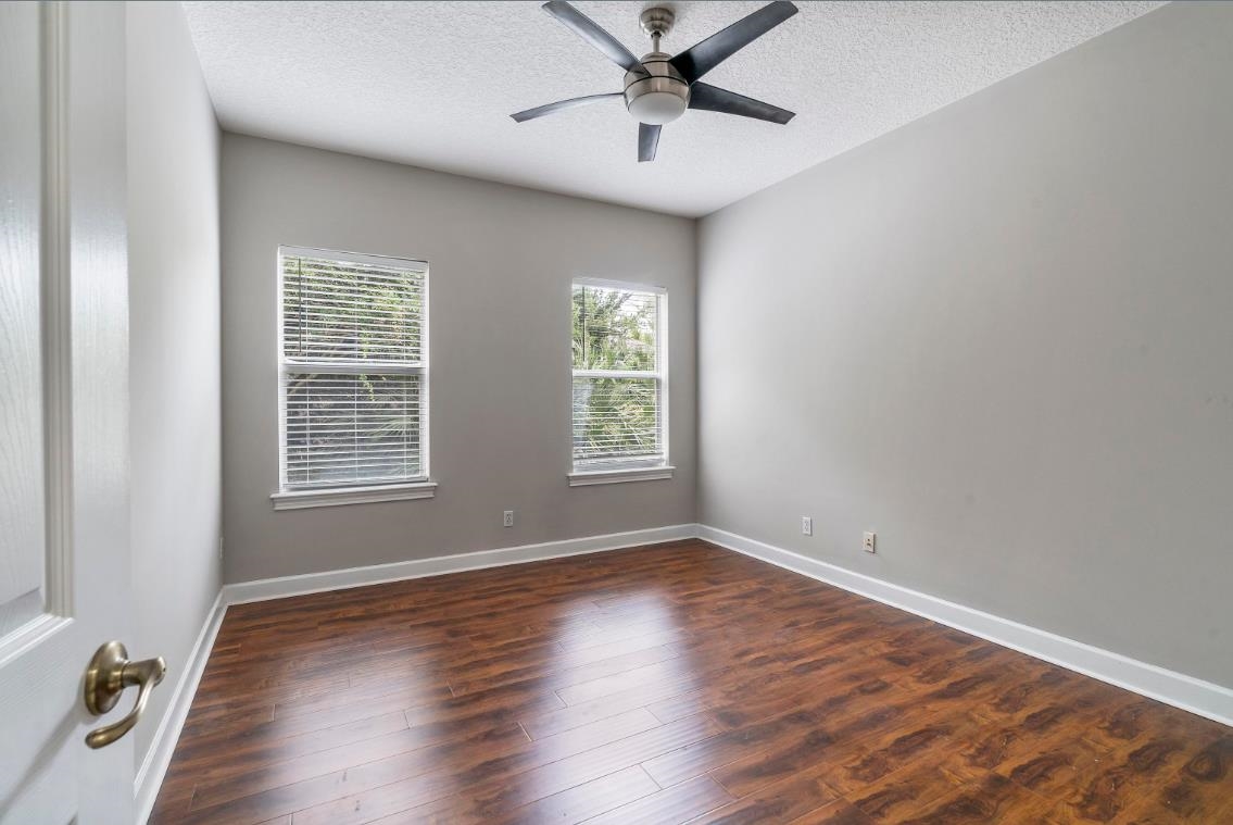 206 2nd Street St. Augustine, FL 32084 - Photo 25 of 32 a view of an empty room with wooden floor and a window