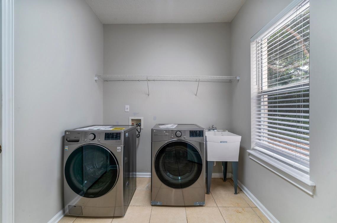 206 2nd Street St. Augustine, FL 32084 - Photo 26 of 32 a utility room with dryer and washer