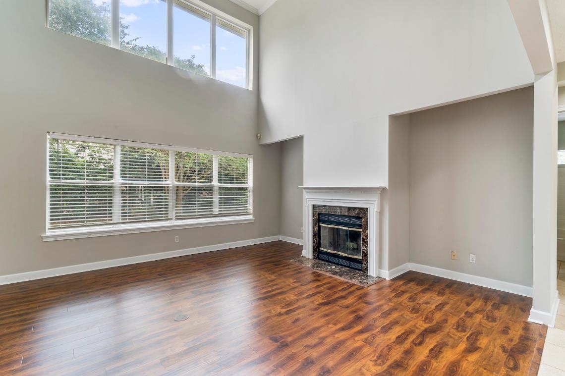 206 2nd Street St. Augustine, FL 32084 - Photo 4 of 32 a view of an empty room with a fireplace and a window