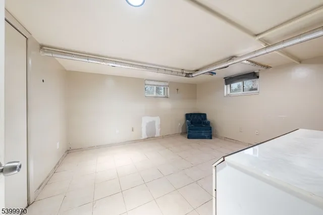 a view of a storage & utility room with two washing machine