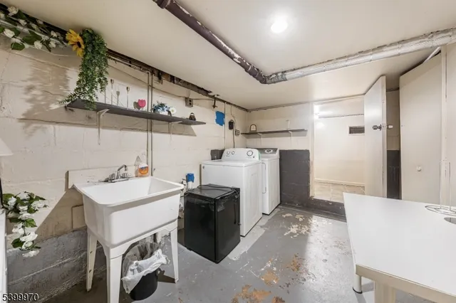 a utility room with cabinets dryer and washer