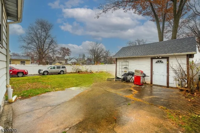 a view of a house with backyard and porch