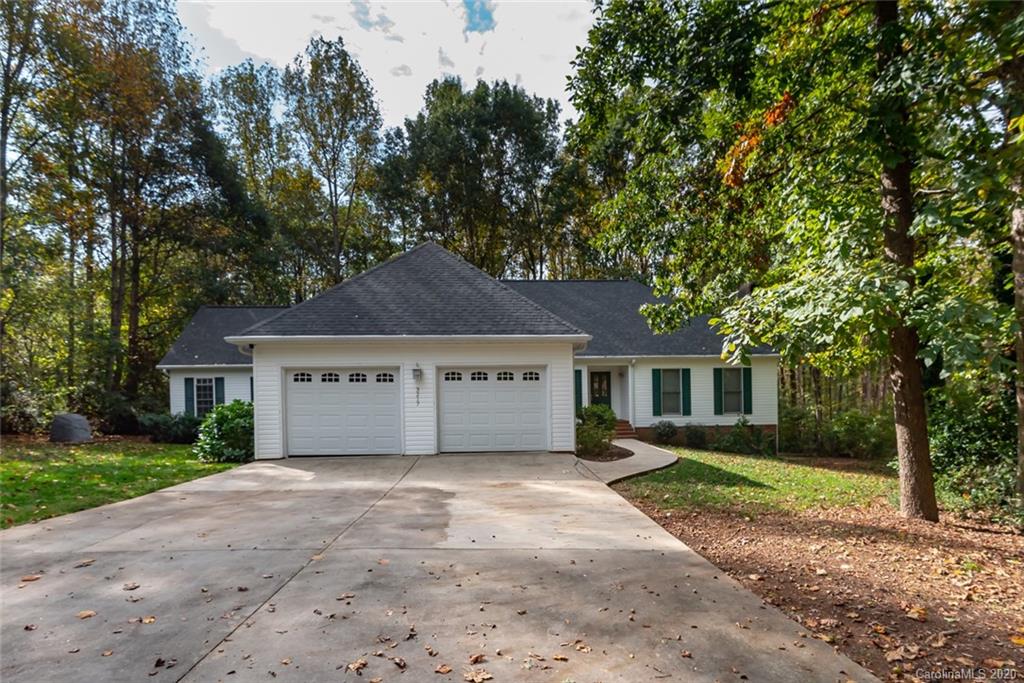 3217 Weidner Road Newton, NC 28658 - Photo 3 of 43 a front view of a house with a garden and trees
