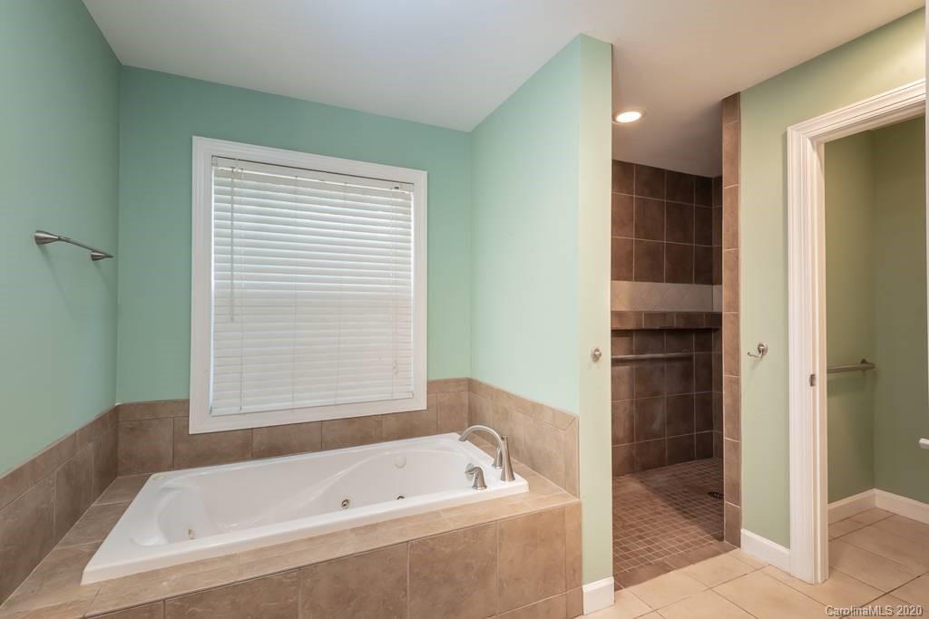 3217 Weidner Road Newton, NC 28658 - Photo 40 of 43 a bathroom with a tub a sink and a shower