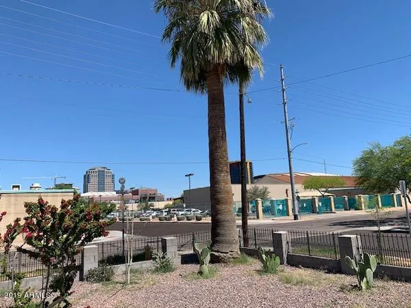 a view of a terrace with chairs and potted plants