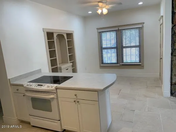 a kitchen with a stove and a sink