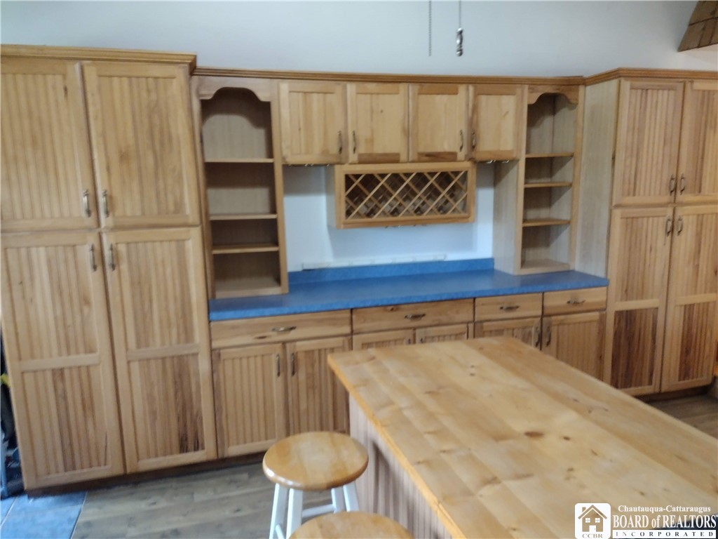 9924 Bailey Hill Road Mina, NY 14781 - Photo 14 of 42 Hickory cabinetry in kitchen - island with eating