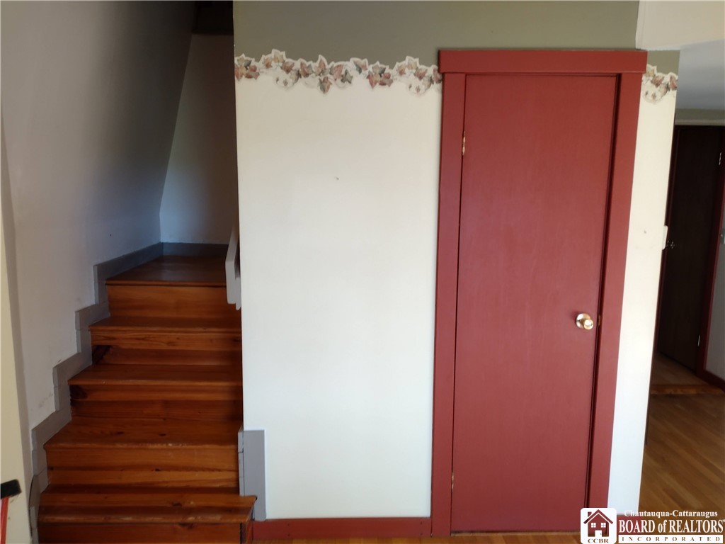 9924 Bailey Hill Road Mina, NY 14781 - Photo 21 of 42 Closet in living room and stairs up