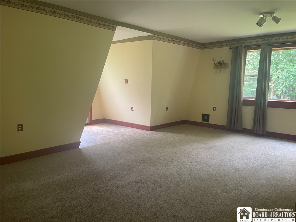 9924 Bailey Hill Road Mina, NY 14781 - Photo 27 of 42 Family room with back entrance door and window to
