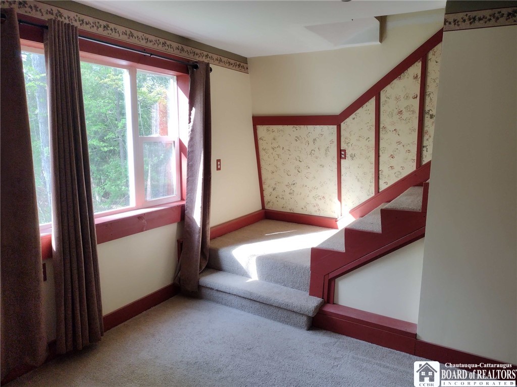 9924 Bailey Hill Road Mina, NY 14781 - Photo 29 of 42 Family room with stairs to bunk room