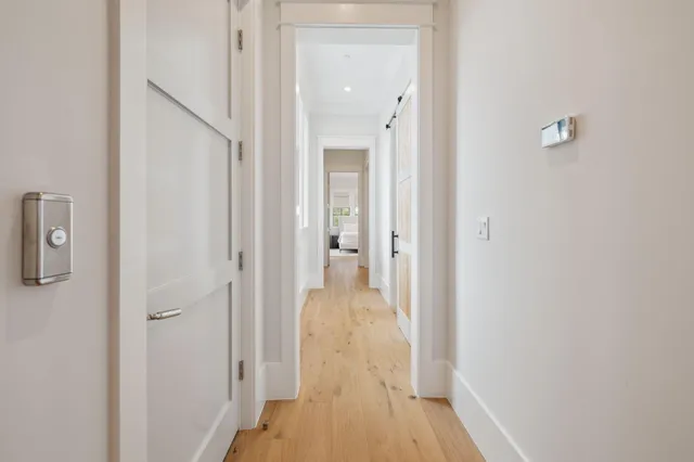 a view of a bathroom from a hallway