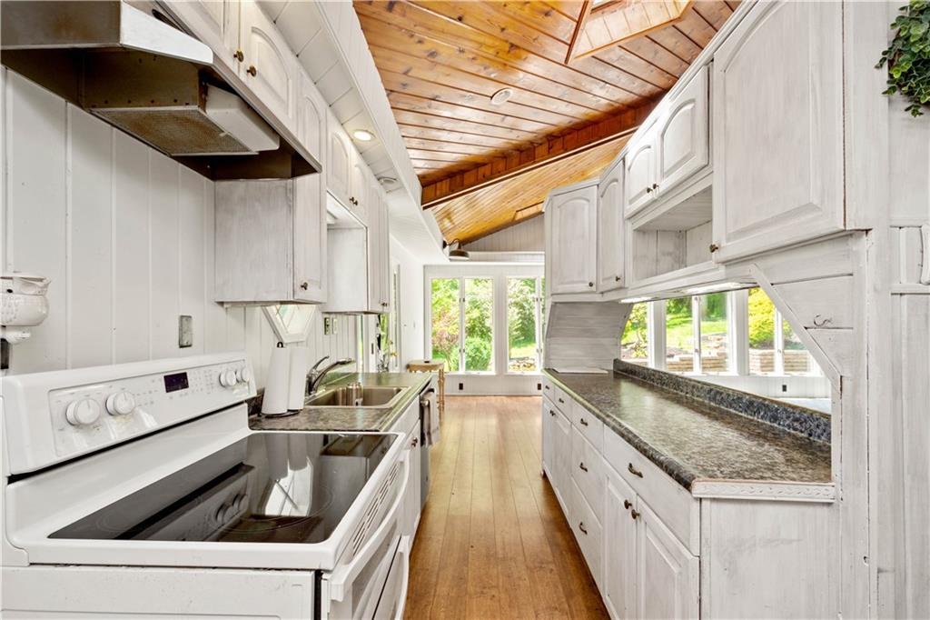 1147 Thomas Eighty Four Road Eighty Four, PA 15330 - Photo 6 of 24 a kitchen that has a sink and a stove