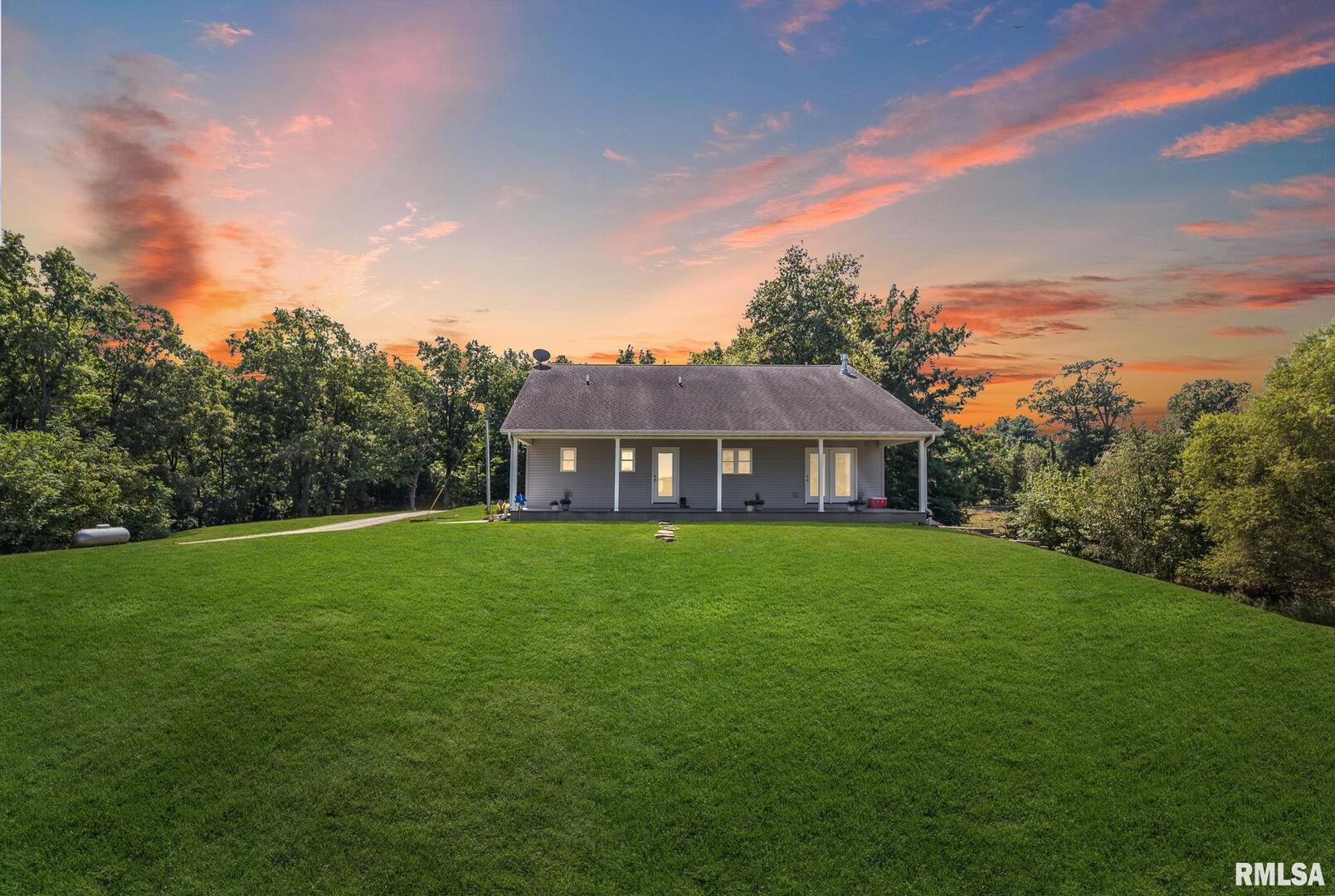 520 Deerfield Road Walnut Hill, IL 62893 - Photo 1 of 85 a view of a big house with a big yard potted plants and large tree