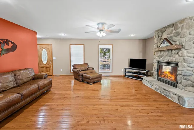 a bedroom with a bed and a flat tv screen on the dresser