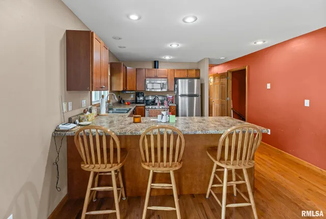 an aerial view of a houses with a yard