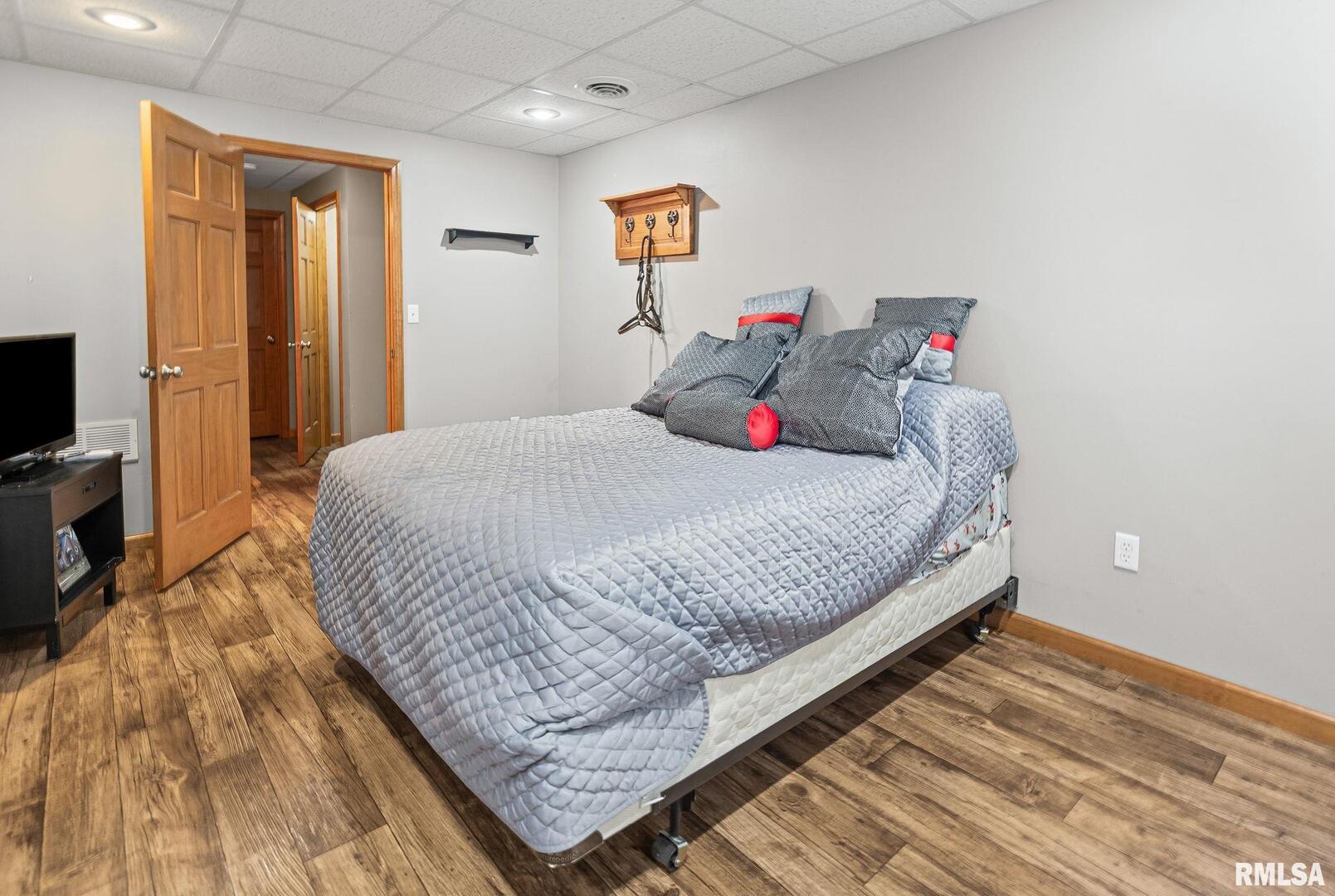 520 Deerfield Road Walnut Hill, IL 62893 - Photo 59 of 85 a bedroom with a bed and a flat tv screen on the dresser