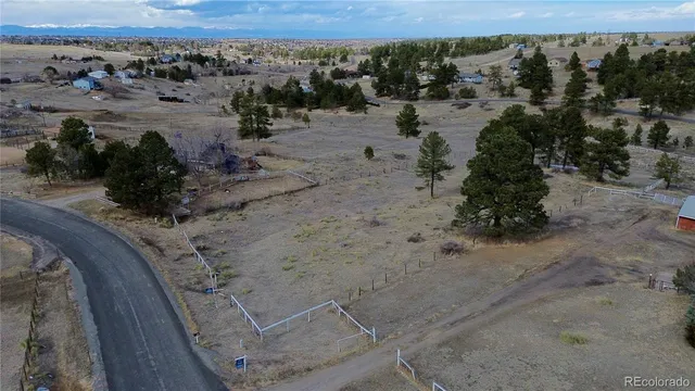 an aerial view of a yard with horses