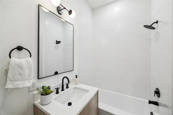 a bathroom with a sink and mirror