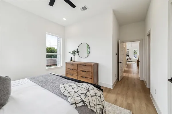 a bedroom with a bed and a dresser